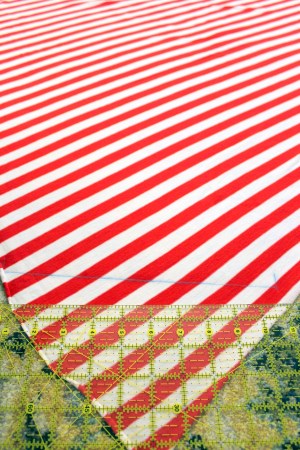 Carefully eyeball the stripes so you get the right diagonal design for the skirt. I did horizontal lines for the middle front and middle back of the skirt. Then cut on a bias for the two side pieces of the skirt.